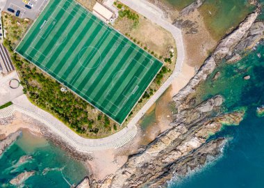 Football field on the reef of Qingdao Island, China clipart