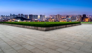 Empty floor tiles and city buildings background clipart