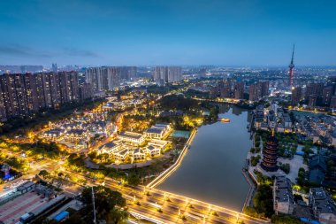 Aerial photography night view of Taizhou city skyline in China clipart