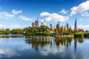 Kunming ethnic village Chinese garden lake natural scenery clipart