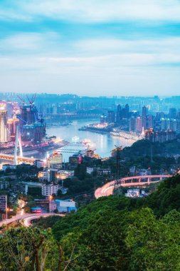 Overlooking the night view of modern buildings in Chongqing Fina clipart