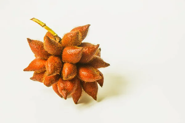 Snake fruit is a sweet and sour fruit. Thai fruit on a white background