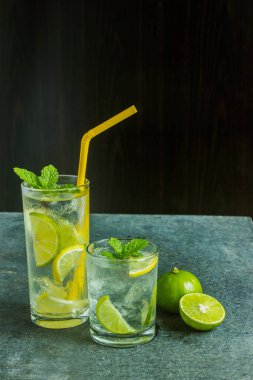 A glass of refreshing mint lemonade and lime juice.