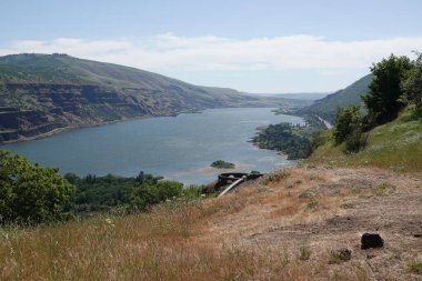 Scenic wide and high angle view on the Columbia river gorge valley from the Rowena crest viewpoint in Oregon clipart