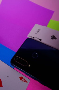 Smartphone photo with playing card pad and colorful paper