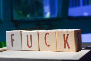 Wooden blocks make up the word 
