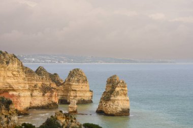 Impressive cliffs at the Benagil Caves site in southern Portugal clipart