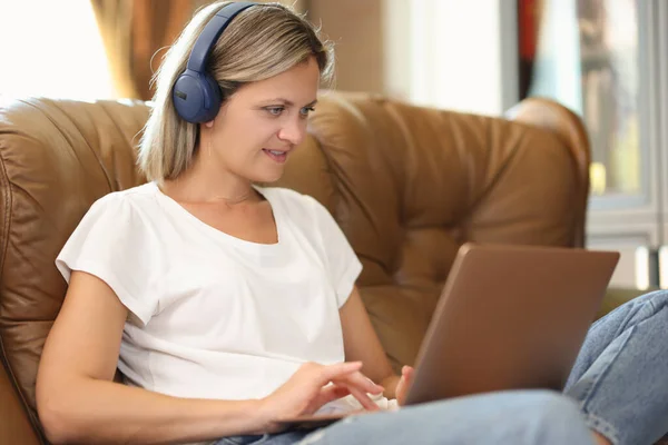 Portrait Young Woman Headphones Sitting Sofa Working Laptop Videochat Distance — Stock Photo, Image