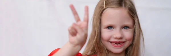 Smiling Little Girl Front Teeth Gesture Two Fingers Portrait Positive — Fotografia de Stock