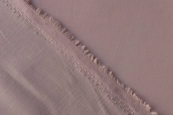 灰粉色纺织品的背面和侧面紧密相连 背景为切割后的灰粉色织物 — 图库照片