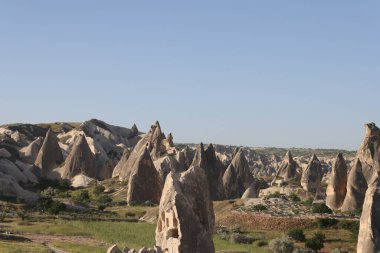 Portrait of cave houses in Uchisar village Cappadocia. Stone ancient houses in Turkey. Travelling and adventure concept