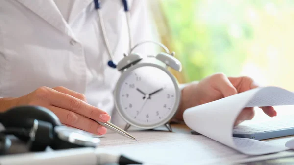 Doctor Alarm Clock Documents Hospital Table Female Cardiologist Looking Medical — Stock Fotó
