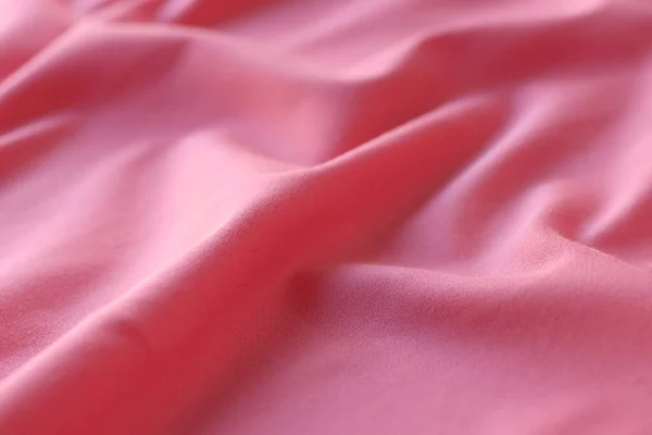 Hullámos Rózsaszín Szatén Szövet Háttér Alakított Selyemszövet Közelsége — Stock Fotó