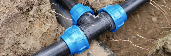 Black plastic pipes for irrigation in country. Irrigation system and pvc pipes concept