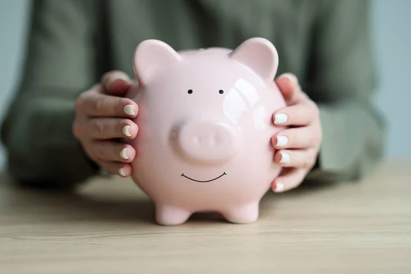 Woman Puts Hands Sides Pink Piggy Bank Embracing Pig Sitting — Stock Photo, Image