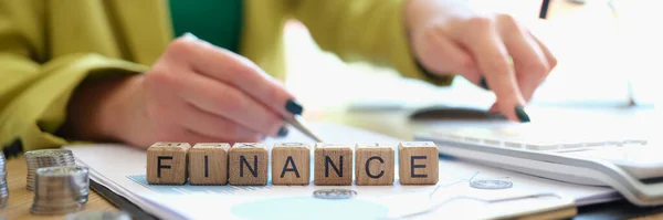 Close Woman Pointing Pen Word Finance Collected Wooden Blocks Business — Stockfoto
