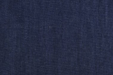 Kıyafet imalatı ve dikimi için yüksek kaliteli koyu mavi kot kumaşı. Arka plan olarak kumaş dokusu. Örneklerin katalog fotoğrafı
