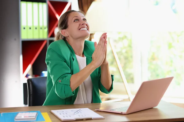 Portrait of happy exciting woman clapping in office. Online business meeting, video conference, team building concept