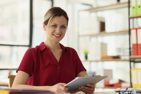 Happy Female Employee Holds Clipboard Sitting Table Modern Office Workplace — Stock Photo, Image