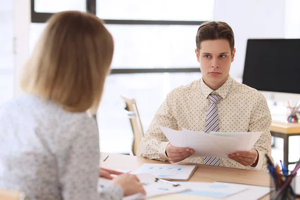 Suspicious Man Looks Woman Reading Project Reports Young Manager Judges — Stock Photo, Image