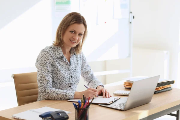Positive Female Manager Smiles Editing Data Clipboard Blonde Woman Sits — Stock Photo, Image