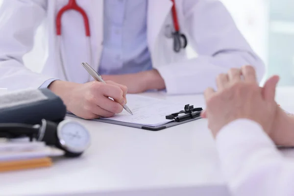 Lady Doctor Fills Form Listening Mature Patient Complaints Table Clinic — Stock Photo, Image