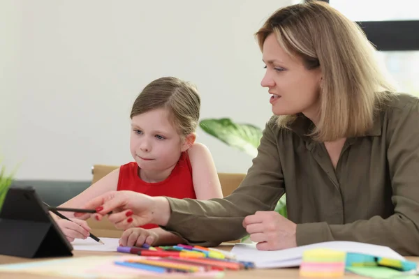 Mother Helps Daughter Homework Woman Explains Information Using Tablet Junior — Stock Photo, Image