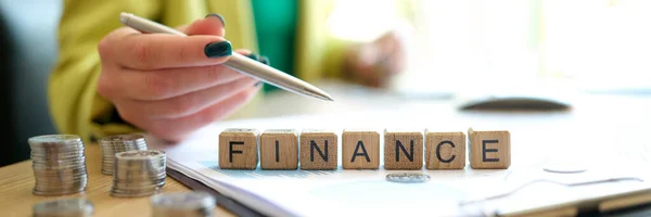 Close Woman Pointing Word Finance Made Wooden Cubes Row Business — Stockfoto