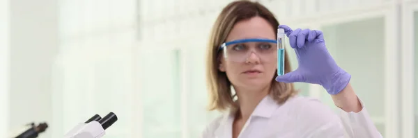 Woman Chemist Looking Test Tube Blue Liquid Front Microscope Laboratory — Stock Photo, Image