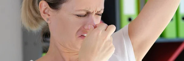 Worried Woman Unhappy Face Checking Smell Her Armpit Office Bad — Foto de Stock