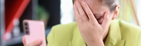 Sad Business Woman Holds Smartphone Her Hand Covers Her Face — Foto Stock