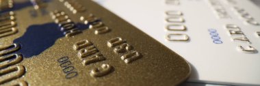 Banking plastic gold and platinum credit card, close-up. Entrepreneurial activity, credit and deposit