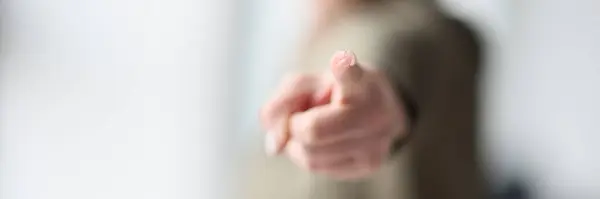 Female Hand Shows Index Finger Shallow Focus Closeup Pointing Gesture — kuvapankkivalokuva