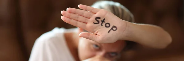 Portrait Scared Woman Covering Face Palm Stop Inscription Protesting Domestic — Stock fotografie
