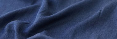 Arkaplan olarak dalgalı mavi tekstil.
