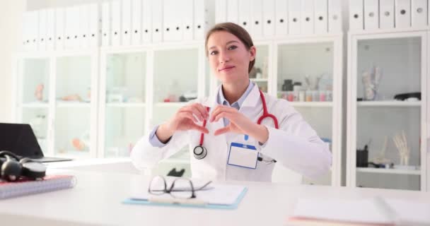 Portrait Happy Female Cardiologist Smiling Showing Love Gesture Fingers Cardiology — Stock Video