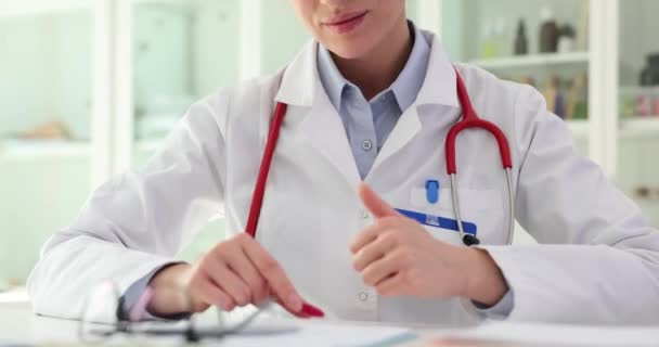 Doctor Holding Red Toy Heart Showing Thumbs Sign Closeup Cardio — Stock Video