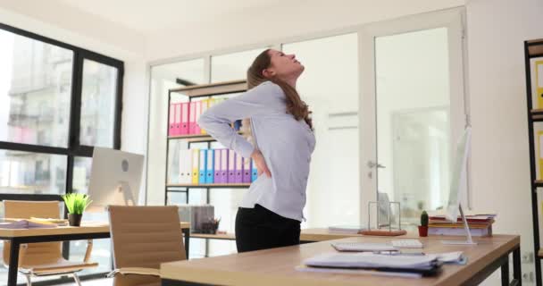 Woman Holds Back Aching Pain Incorrect Sitting Position Workplace Company — Stock Video