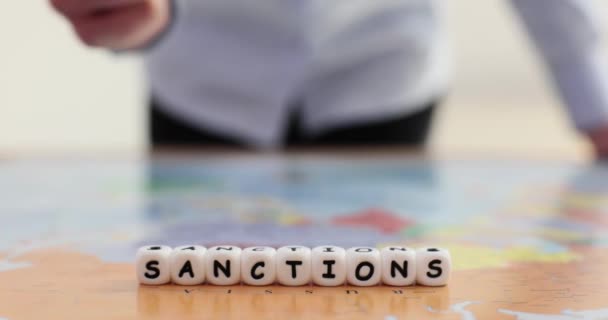 Woman Hits Table Fist Word Sanctions Made Cubes Letters Put — Stock Video