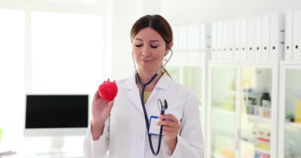 Doctor Listens Stethoscope Red Heart Recommends Undergoing Examination Treatment Heart — Stock Video