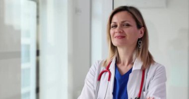 Portrait of happy smiling female doctor in clinic 4k movie slow motion. Insurance in medicine concept