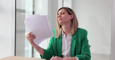 Tired businesswoman waving papers and documents in hot office 4k movie slow motion. Overwork concept