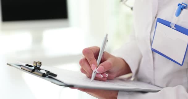 Doctor Writing Medical Documents Ballpoint Pen Clinic Closeup Movie Slow — Vídeos de Stock