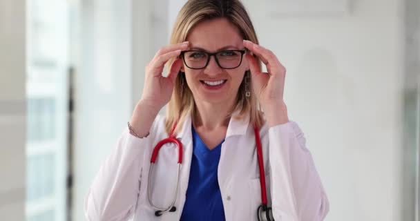 Smiling Woman Doctor Taking Vision Glasses Portrait Movie Slow Motion — Stockvideo