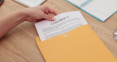 Manager hand taking out paper contract from yellow envelope closeup 4k movie slow motion. Closing deals remotely concept