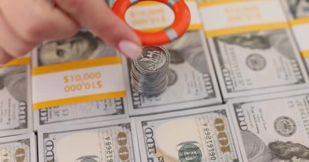 Hand Putting Lifebuoy Coins Dollar Bills Closeup Movie Slow Motion — ストック動画
