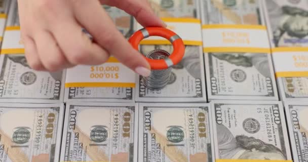 Woman Hand Puts Life Preserver Stack Coins Placed Banknotes Providing — Stock Video