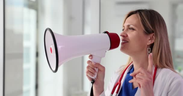 Portrait Female Doctor Speaking Loudly Megaphone Medical Announcement Warning — Stock Video