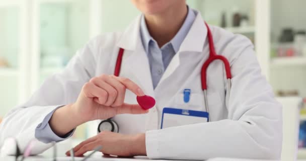 Woman Doctor Shows Small Red Heart Shape Badge Sign Caring — Stock Video