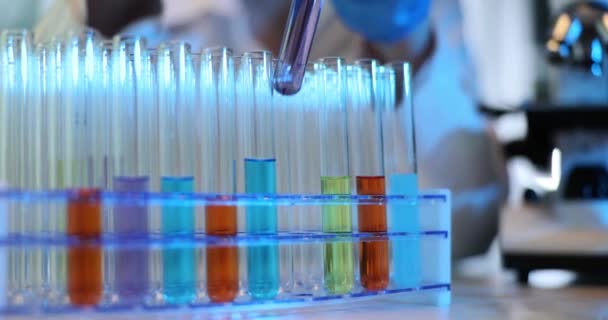 Scientist Replaces Test Tubes Colourful Liquids Rack Researcher Substitutes Containers — Stock Video